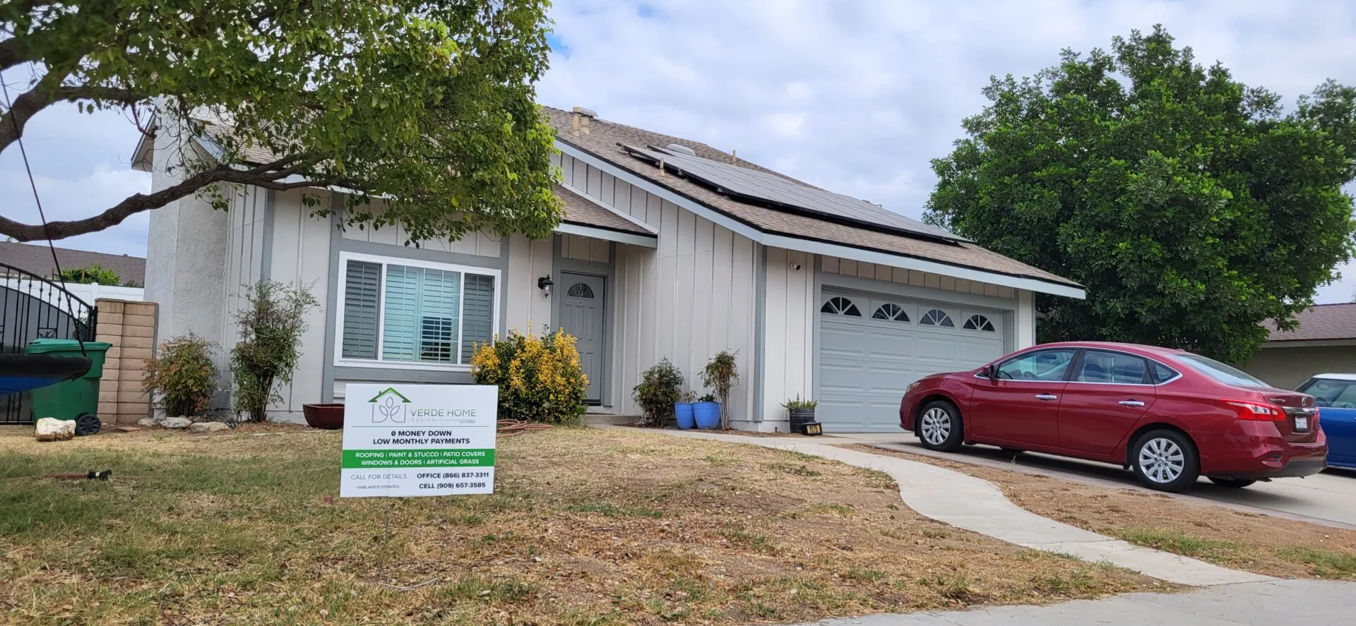 Home with a new shingle roof and solar panels reinstalled